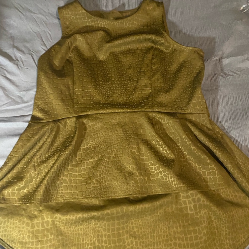 Dark green, sleeveless top with a snake-like embossed print.